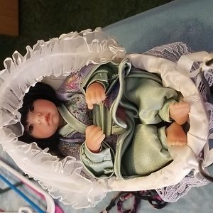 Lee middleton minature asian doll in carriage